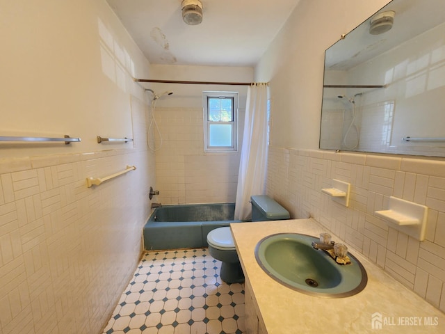 138 The Orchards Unit C, East Windsor, NJ 08512 - full bath with shower / bath combination with curtain, tile walls, vanity, tile patterned floors, and wainscoting