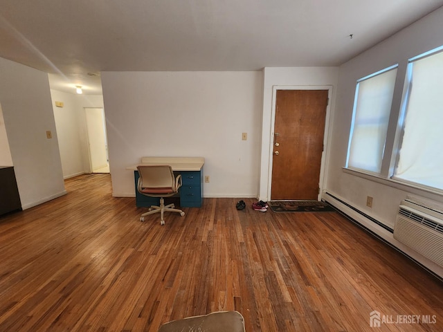 138 The Orchards Unit C, East Windsor, NJ 08512 - unfurnished living room with wood-type flooring and baseboard heating