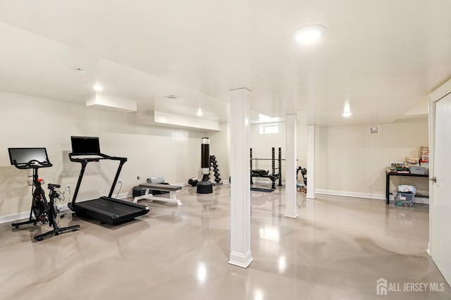 exercise room with recessed lighting and baseboards