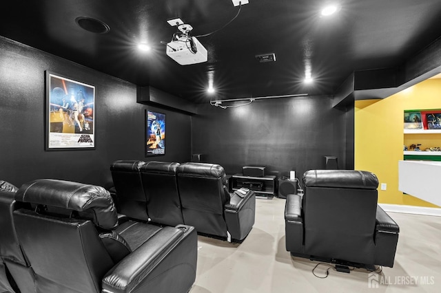 home theater room featuring recessed lighting, visible vents, and concrete flooring