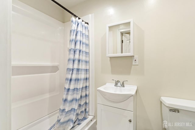 full bathroom with vanity and toilet