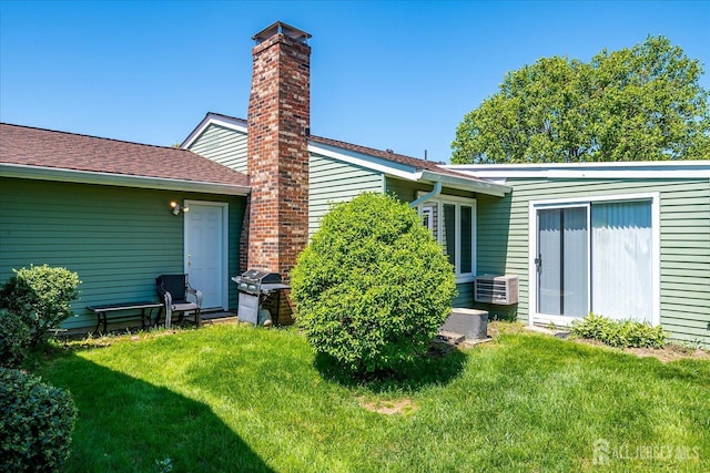 444 Dahlia Plz, Monroe, NJ 08831 - back of house with a yard and a chimney