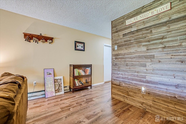 444 Dahlia Plz, Monroe, NJ 08831 - sitting room with a textured ceiling, wood finished floors, and wood walls