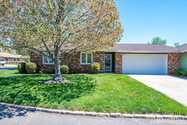444 Dahlia Plz, Monroe, NJ 08831 - view of front of home featuring an attached garage, a front yard, driveway, and brick siding