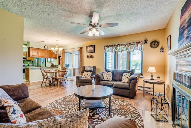444 Dahlia Plz, Monroe, NJ 08831 - living area featuring a chandelier, a ceiling fan, a textured ceiling, light wood-type flooring, and baseboard heating