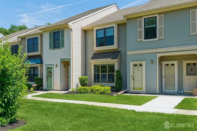 151 Wyndham Pl, Robbinsville, NJ 08691 - multi unit property featuring a front lawn and roof with shingles