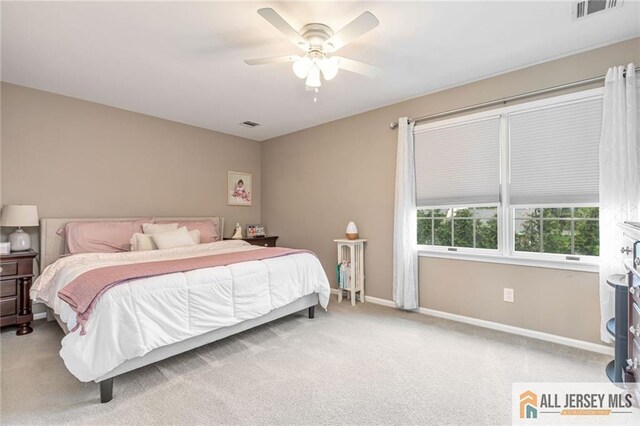 bedroom featuring carpet flooring, baseboards, and ceiling fan