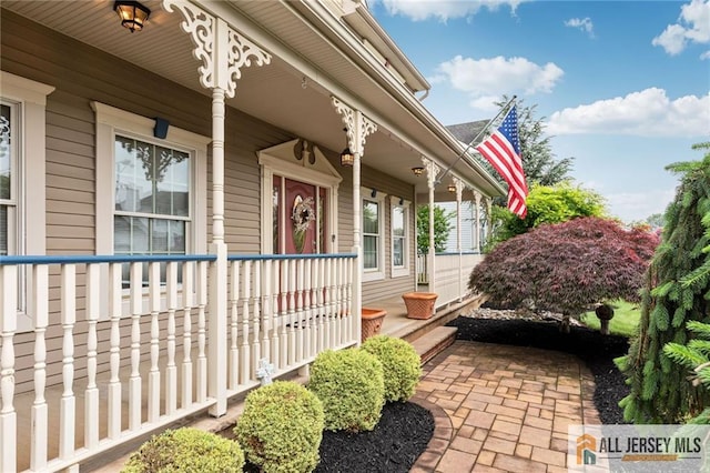 property entrance with covered porch