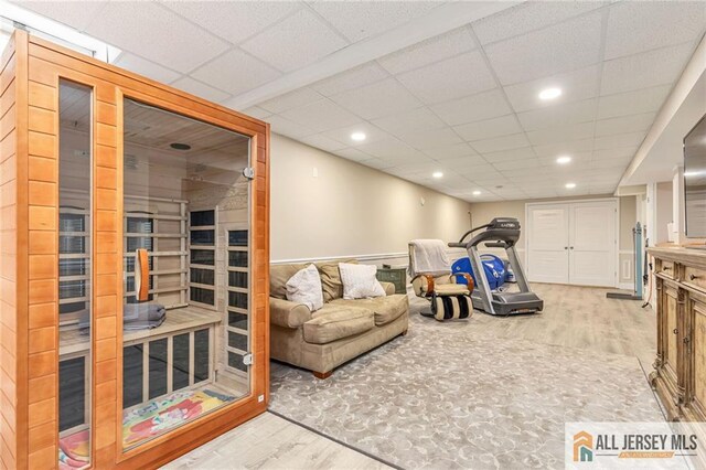 recreation room with wood finished floors and recessed lighting