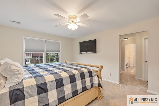 carpeted bedroom with baseboards and a ceiling fan