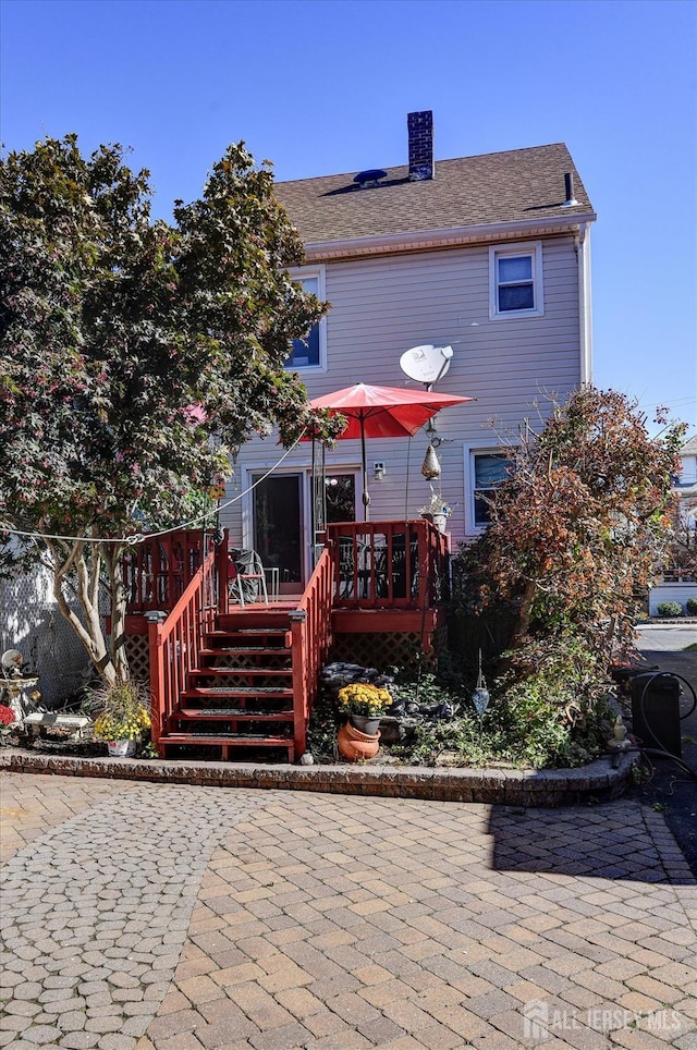 352 Parker Ave, South Amboy, NJ 08879 - rear view of house with a deck, a patio area, a chimney, and stairway