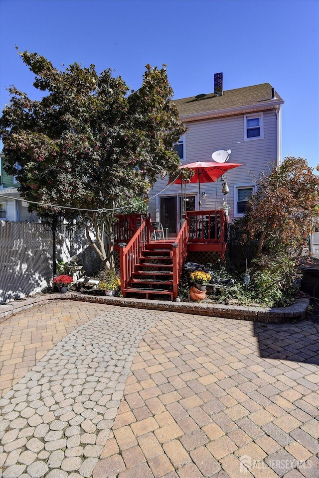 352 Parker Ave, South Amboy, NJ 08879 - rear view of property featuring a patio, a deck, a chimney, and stairway