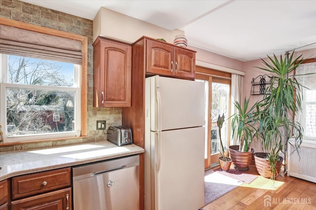 352 Parker Ave, South Amboy, NJ 08879 - kitchen featuring freestanding refrigerator, dishwasher, healthy amount of natural light, and wood finished floors