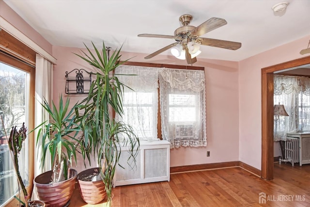 352 Parker Ave, South Amboy, NJ 08879 - sitting room featuring a ceiling fan, baseboards, wood finished floors, and radiator
