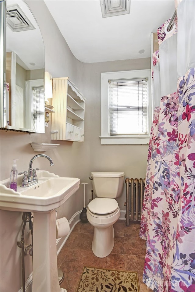 352 Parker Ave, South Amboy, NJ 08879 - bathroom with toilet, radiator, baseboards, and a shower with curtain