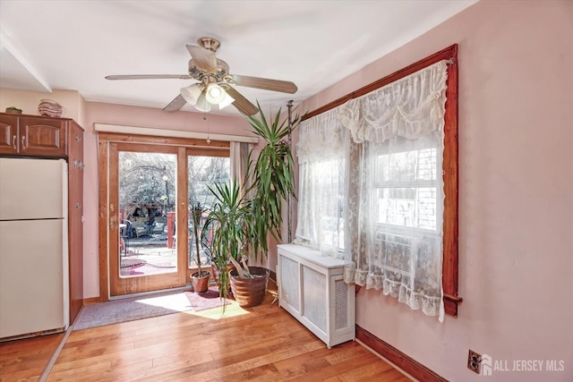 352 Parker Ave, South Amboy, NJ 08879 - interior space featuring light wood-type flooring, ceiling fan, baseboards, and cooling unit