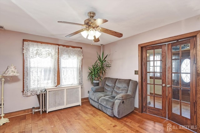 352 Parker Ave, South Amboy, NJ 08879 - sitting room with radiator, baseboards, wood-type flooring, and ceiling fan