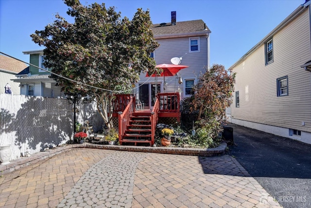 352 Parker Ave, South Amboy, NJ 08879 - rear view of property with a deck and a chimney