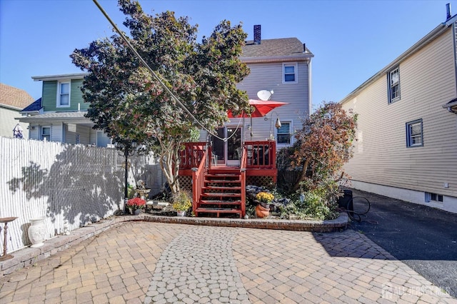 352 Parker Ave, South Amboy, NJ 08879 - rear view of house featuring a patio, a deck, and a chimney
