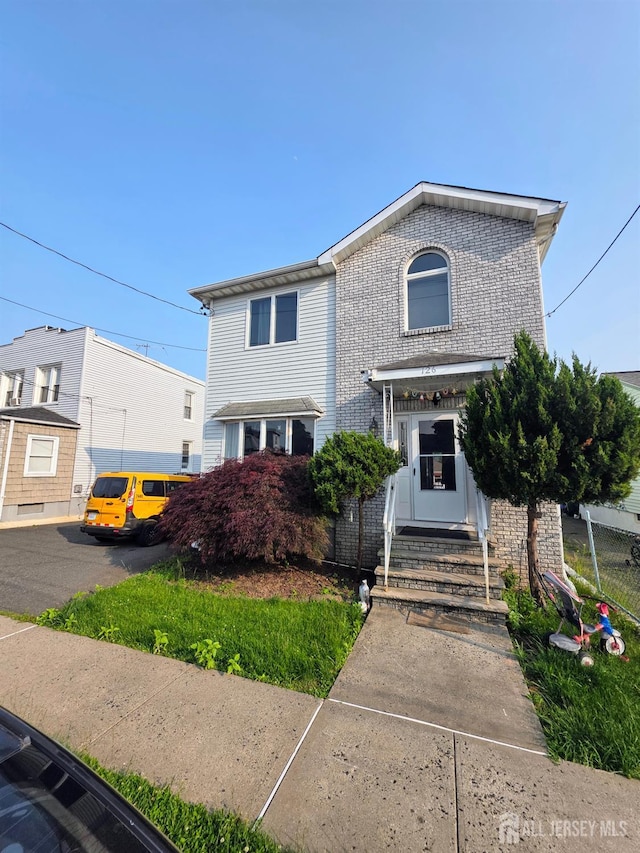 126 Holly St, Port Reading, NJ 07064 - view of front of property featuring entry steps and brick siding