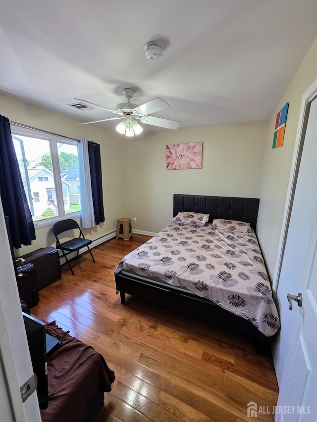 126 Holly St, Port Reading, NJ 07064 - bedroom featuring wood-type flooring and ceiling fan