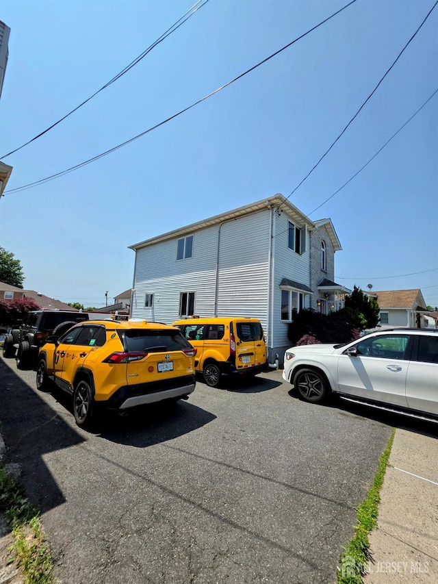 126 Holly St, Port Reading, NJ 07064 - view of side of property with uncovered parking