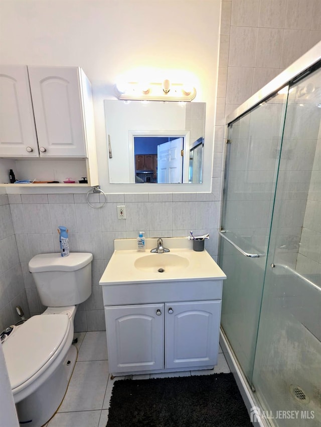 126 Holly St, Port Reading, NJ 07064 - full bathroom with tile walls, vanity, toilet, a shower stall, and tile patterned floors