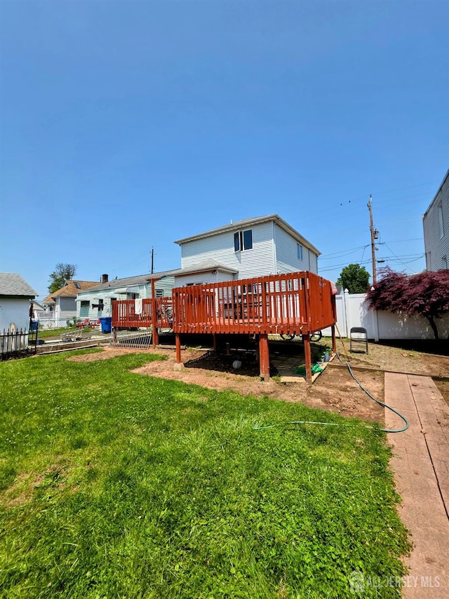 126 Holly St, Port Reading, NJ 07064 - rear view of property with a wooden deck
