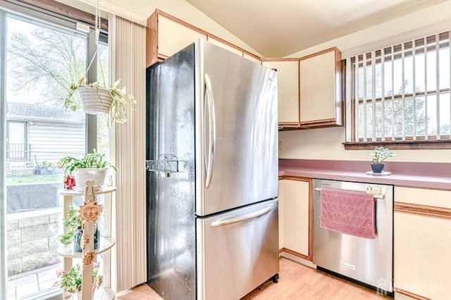 6 Schuyler Dr, Edison, NJ 08817 - kitchen featuring appliances with stainless steel finishes, plenty of natural light, vaulted ceiling, light wood finished floors, and light countertops