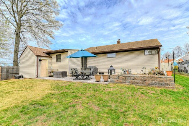 6 Schuyler Dr, Edison, NJ 08817 - back of house with a patio area and a chimney