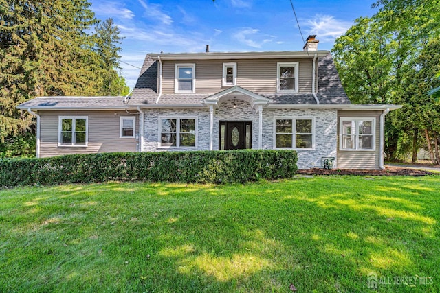 790 Ridge Rd, South Brunswick, NJ 08852 - view of front of house with a chimney, stone siding, and a front lawn