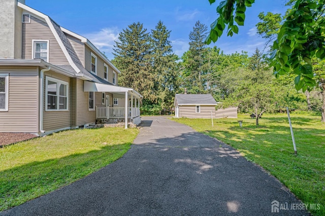 790 Ridge Rd, South Brunswick, NJ 08852 - view of home's exterior with covered porch, a lawn, driveway, and a gambrel roof
