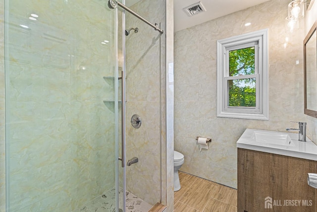 790 Ridge Rd, South Brunswick, NJ 08852 - bathroom with tile walls, vanity, and a stall shower