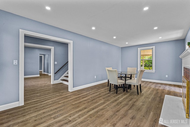 790 Ridge Rd, South Brunswick, NJ 08852 - dining room featuring wood finished floors, stairway, a fireplace with flush hearth, and recessed lighting
