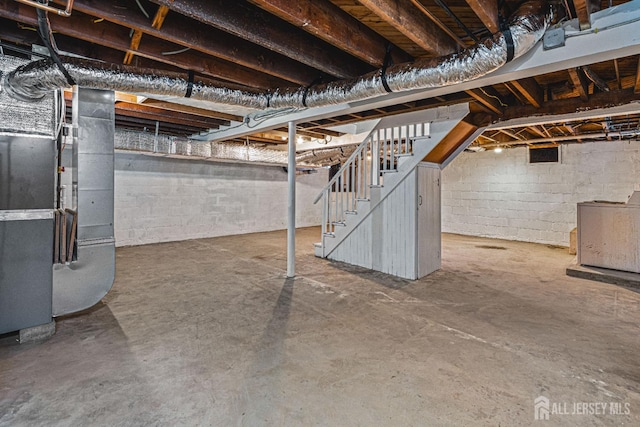 790 Ridge Rd, South Brunswick, NJ 08852 - unfinished basement featuring stairs, heating unit, and washer / dryer