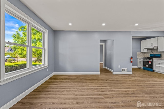 790 Ridge Rd, South Brunswick, NJ 08852 - unfurnished living room with light wood-style flooring and recessed lighting