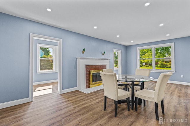 790 Ridge Rd, South Brunswick, NJ 08852 - dining area featuring wood finished floors, a brick fireplace, and recessed lighting