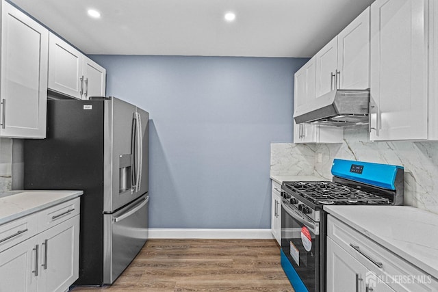 790 Ridge Rd, South Brunswick, NJ 08852 - kitchen with stainless steel appliances, extractor fan, decorative backsplash, white cabinetry, and light wood finished floors