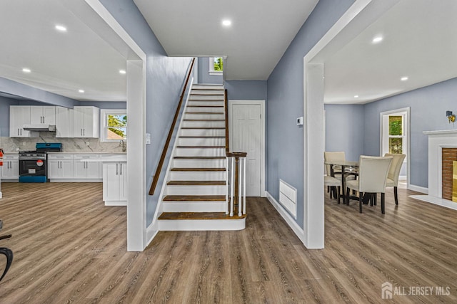790 Ridge Rd, South Brunswick, NJ 08852 - stairway with wood finished floors, healthy amount of natural light, and recessed lighting