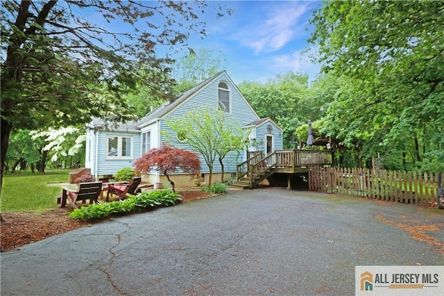 687 Spotswood-Englishtown Rd, Monroe, NJ 08831 - view of home's exterior with a deck, fence, and stairway