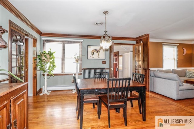 687 Spotswood-Englishtown Rd, Monroe, NJ 08831 - dining room with crown molding, a chandelier, light wood finished floors, baseboards, and a baseboard heating unit