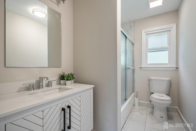 34 Hershey Rd, East Brunswick, NJ 08816 - full bathroom featuring marble finish flooring, toilet, vanity, baseboards, and enclosed tub / shower combo
