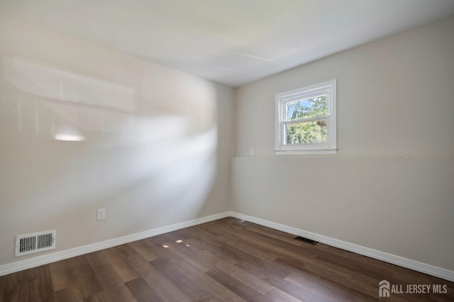 34 Hershey Rd, East Brunswick, NJ 08816 - spare room featuring dark wood-style floors and baseboards