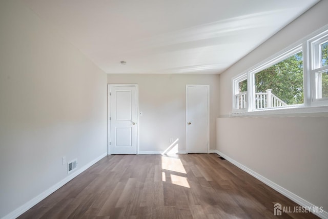 34 Hershey Rd, East Brunswick, NJ 08816 - unfurnished bedroom with wood finished floors and baseboards