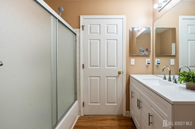 181 Windsong Cir E, Brunswick, NJ 08816 - bathroom with vanity, wood finished floors, and enclosed tub / shower combo