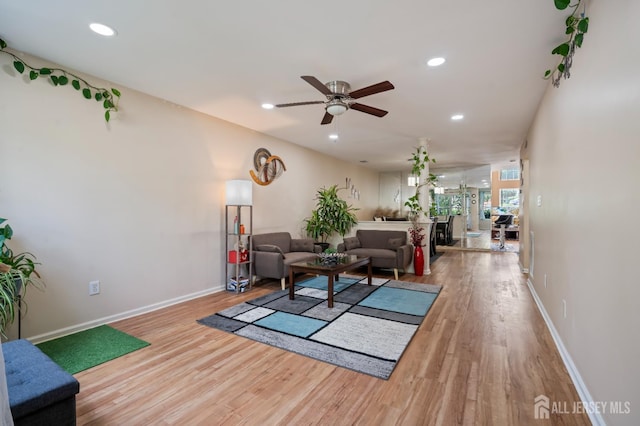 181 Windsong Cir E, Brunswick, NJ 08816 - living area featuring wood finished floors, ceiling fan, recessed lighting, and baseboards