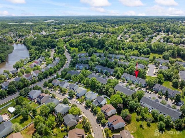 181 Windsong Cir E, Brunswick, NJ 08816 - aerial perspective of suburban area featuring a large body of water and a forest