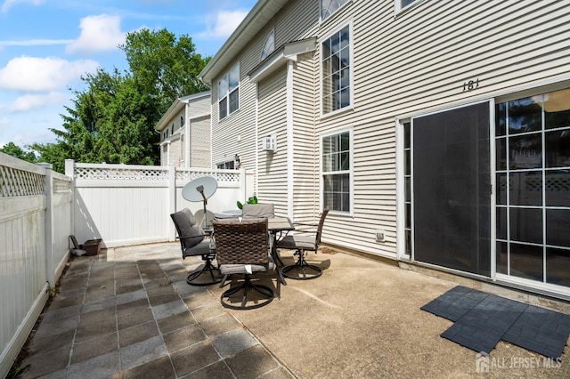 181 Windsong Cir E, Brunswick, NJ 08816 - fenced backyard with a patio and outdoor dining space