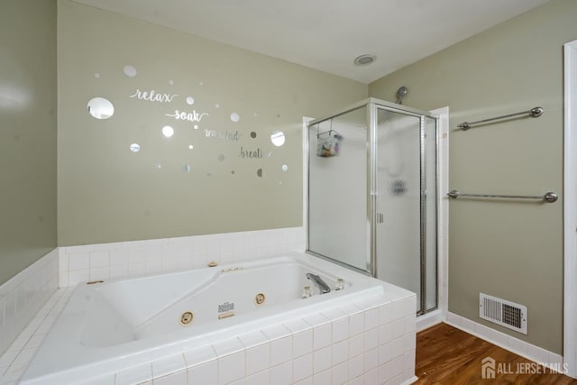 181 Windsong Cir E, Brunswick, NJ 08816 - full bath featuring a jetted tub, a stall shower, wood finished floors, and baseboards