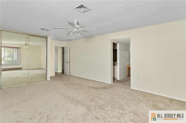 747 Marlton Rd Unit 747A, Monroe, NJ 08831 - unfurnished bedroom featuring carpet flooring, a baseboard radiator, a textured ceiling, ensuite bath, and ceiling fan